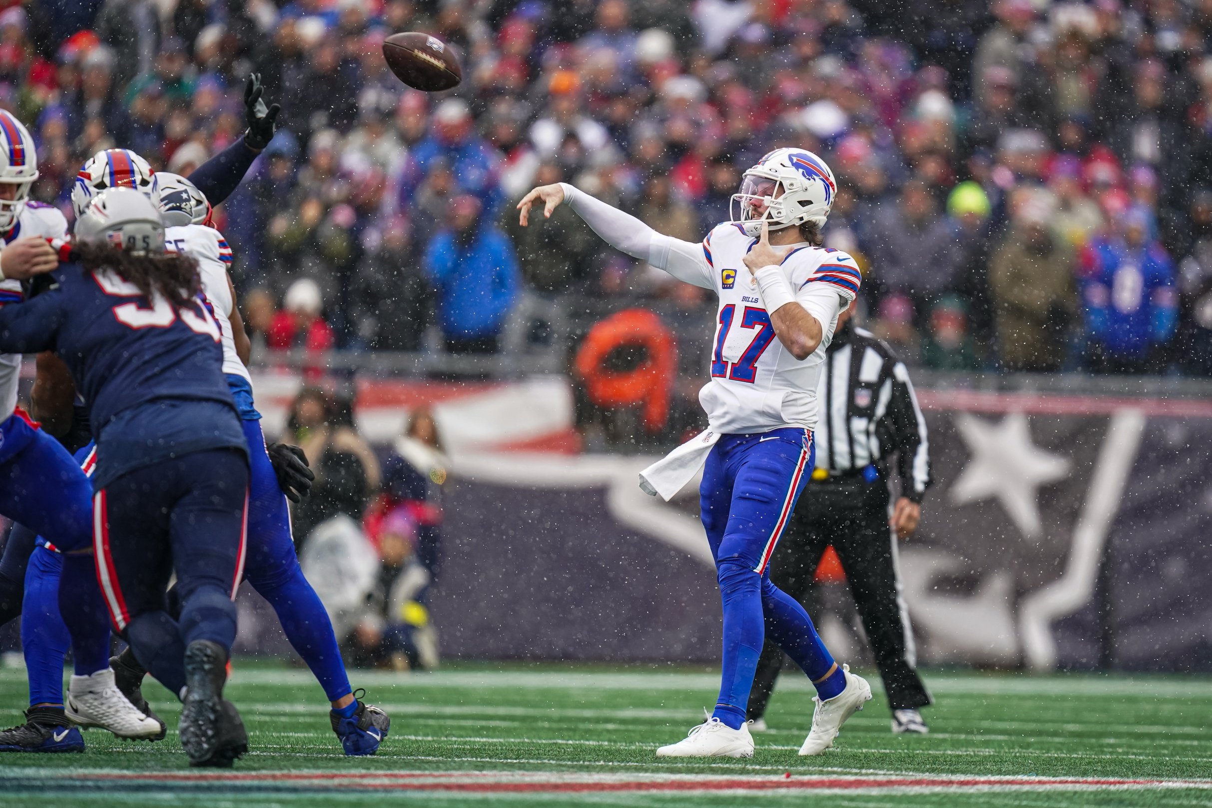 Dec 14, 2025; Foxborough, Massachusetts, USA; Buffalo Bills quarterback Josh Allen (17) passes the ball against the New England Patriots in the first quarter at Gillette Stadium. Mandatory Credit: David Butler II-Imagn Images