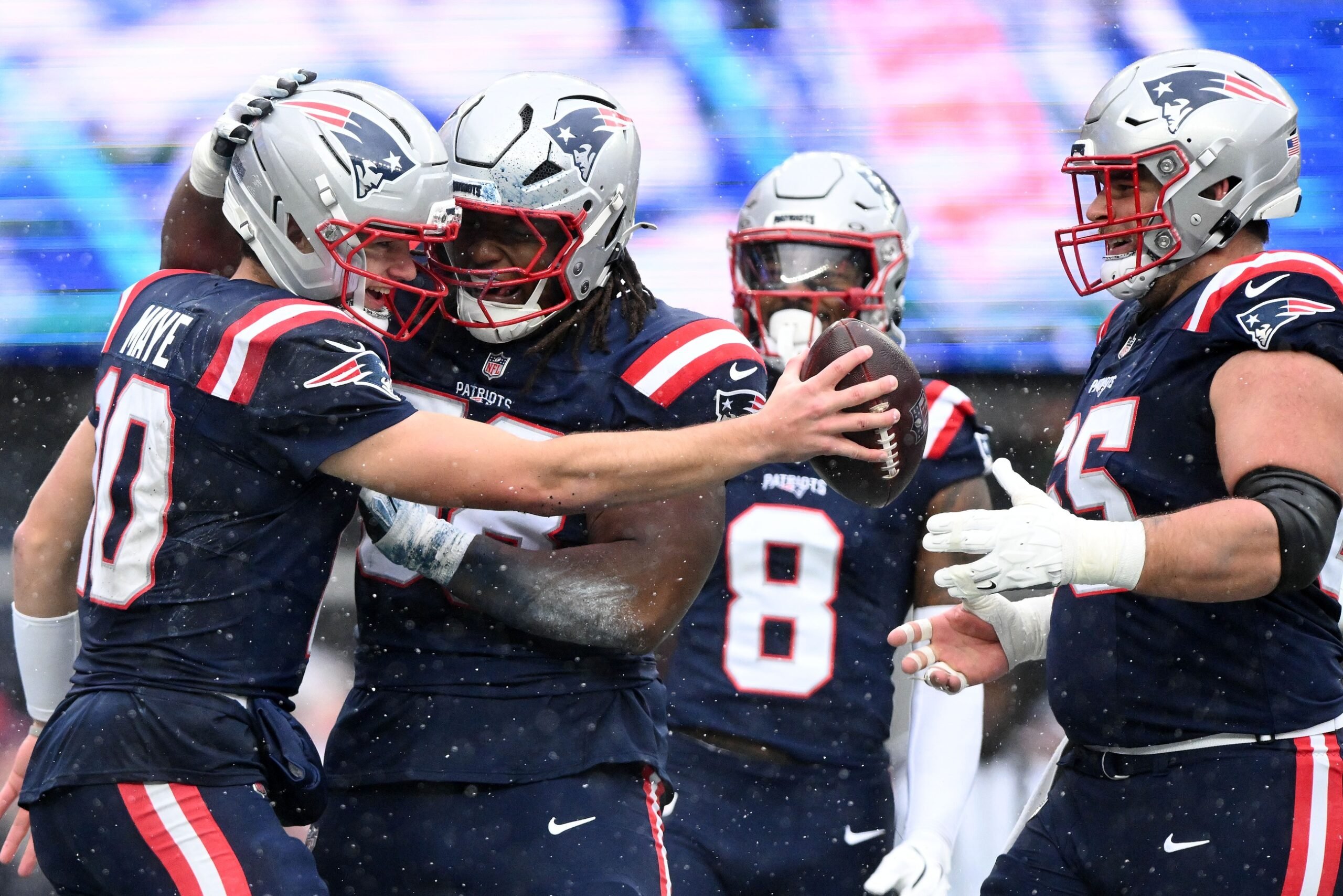 Dec 14, 2025; Foxborough, Massachusetts, USA; New England Patriots quarterback Drake Maye (10) celebrates with his teammates after scoring a touchdown against the Buffalo Bills during the first half at Gillette Stadium. Mandatory Credit: Brian Fluharty-Imagn Images