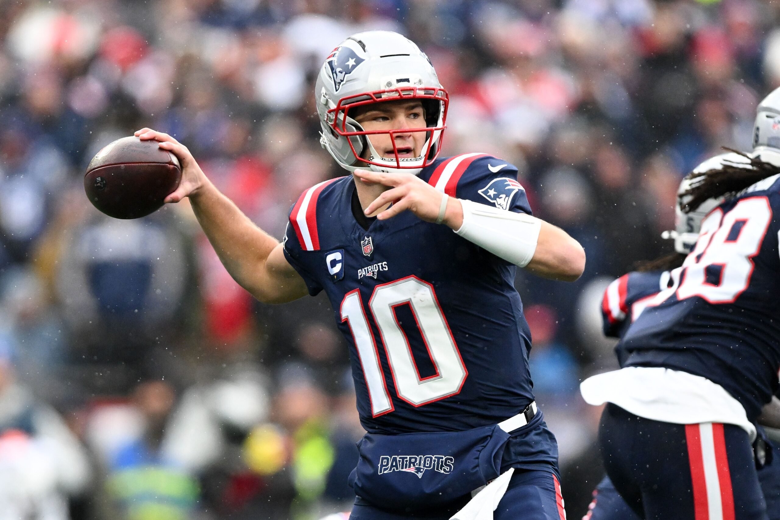 Dec 14, 2025; Foxborough, Massachusetts, USA; New England Patriots quarterback Drake Maye (10) throws the ball against the Buffalo Bills during the first half at Gillette Stadium. Mandatory Credit: Brian Fluharty-Imagn Images