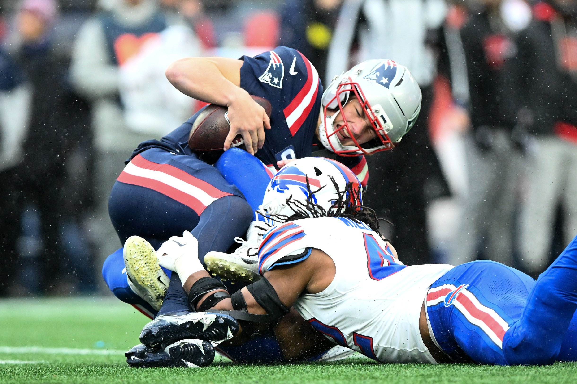 Dec 14, 2025; Foxborough, Massachusetts, USA; New England Patriots quarterback Drake Maye (10) is sacked by Buffalo Bills linebacker Matt Milano (58) during the second half at Gillette Stadium. Mandatory Credit: Brian Fluharty-Imagn Images