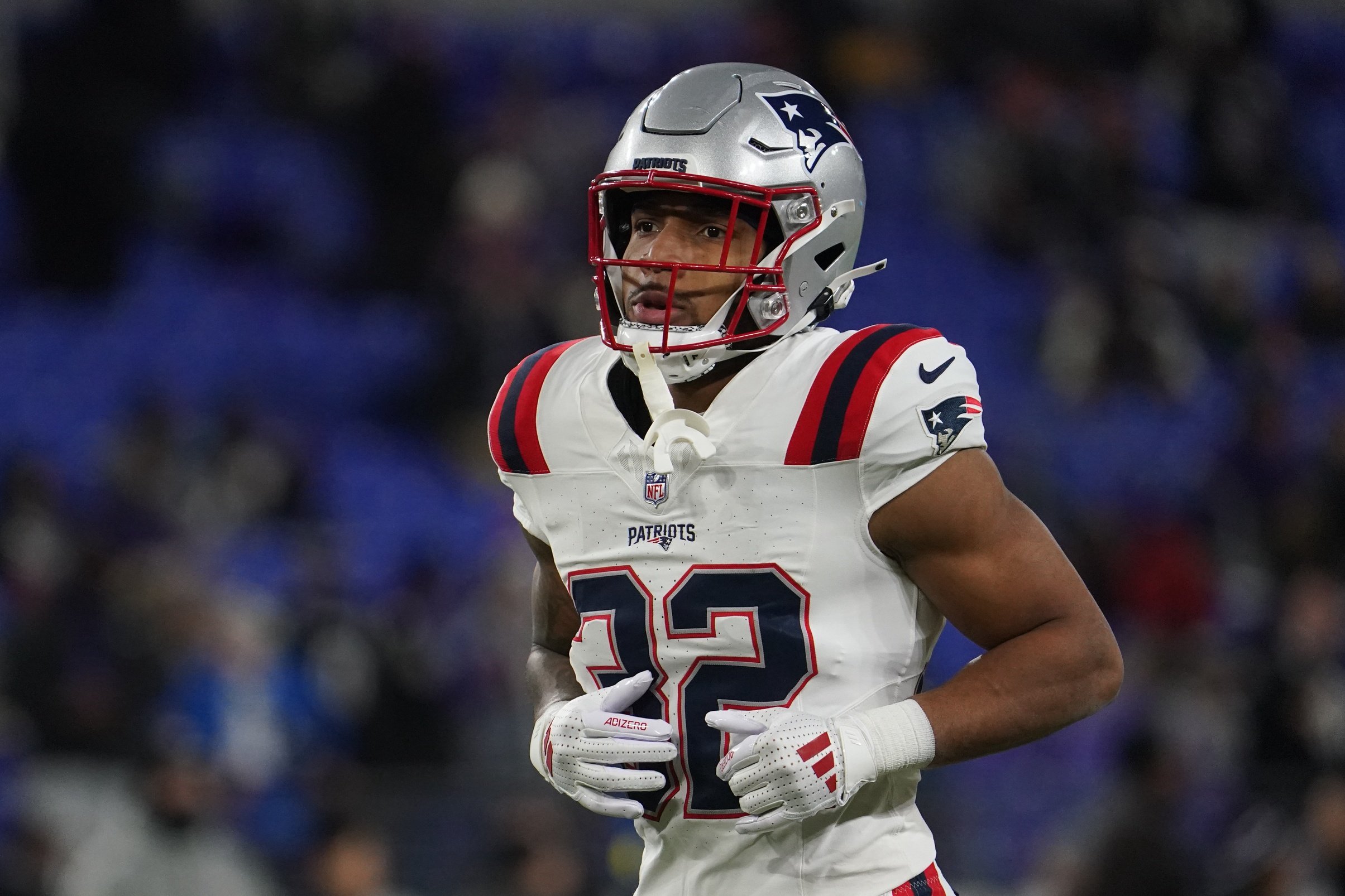 Dec 21, 2025; Baltimore, Maryland, USA; New England Patriots running back Treveyon Henderson (32) warms up prior to the game against the Baltimore Ravens at M&T Bank Stadium. Mandatory Credit: James Lang-Imagn Images