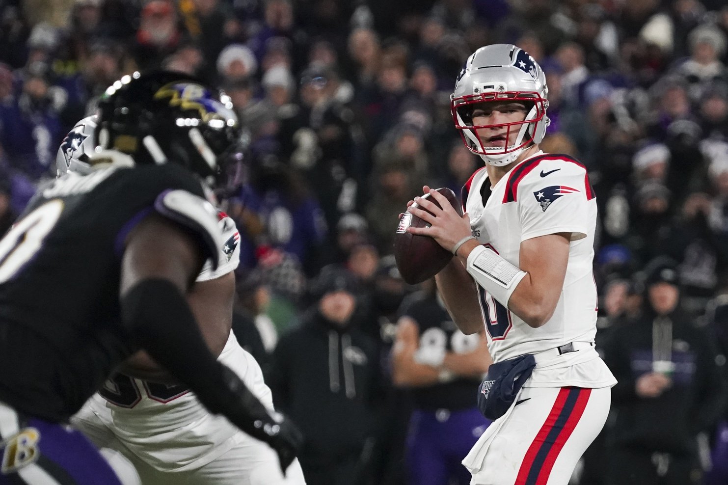 Dec 21, 2025; Baltimore, Maryland, USA;  New England Patriots quarterback Drake Maye (10) looks to pass against the Baltimore Ravens during the first quarter of the game at M&T Bank Stadium. Mandatory Credit: James Lang-Imagn Images