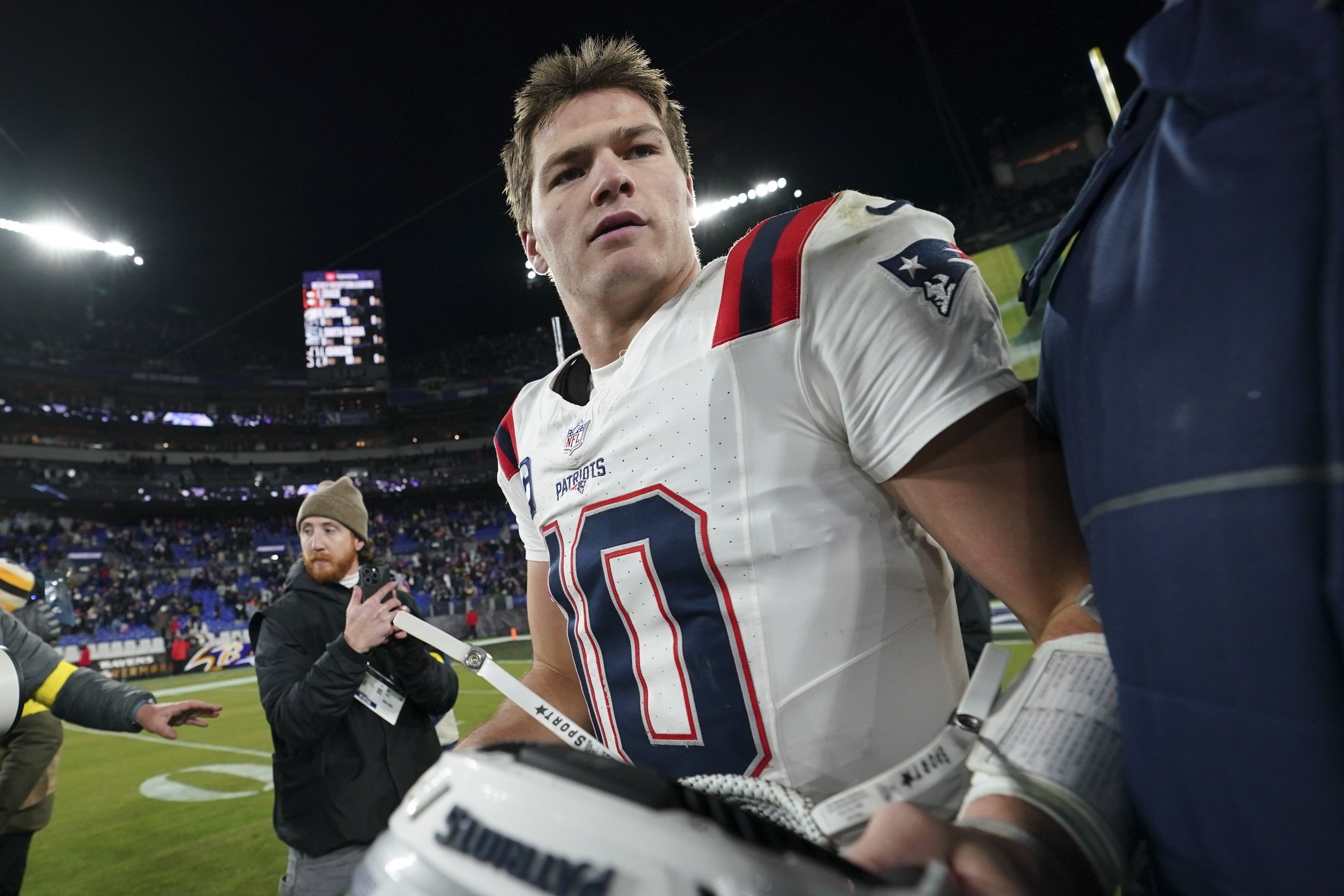 Dec 21, 2025; Baltimore, Maryland, USA;  New England Patriots quarterback Drake Maye (10) walks off the field after defeating the Baltimore Ravens at M&T Bank Stadium. Mandatory Credit: James Lang-Imagn Images