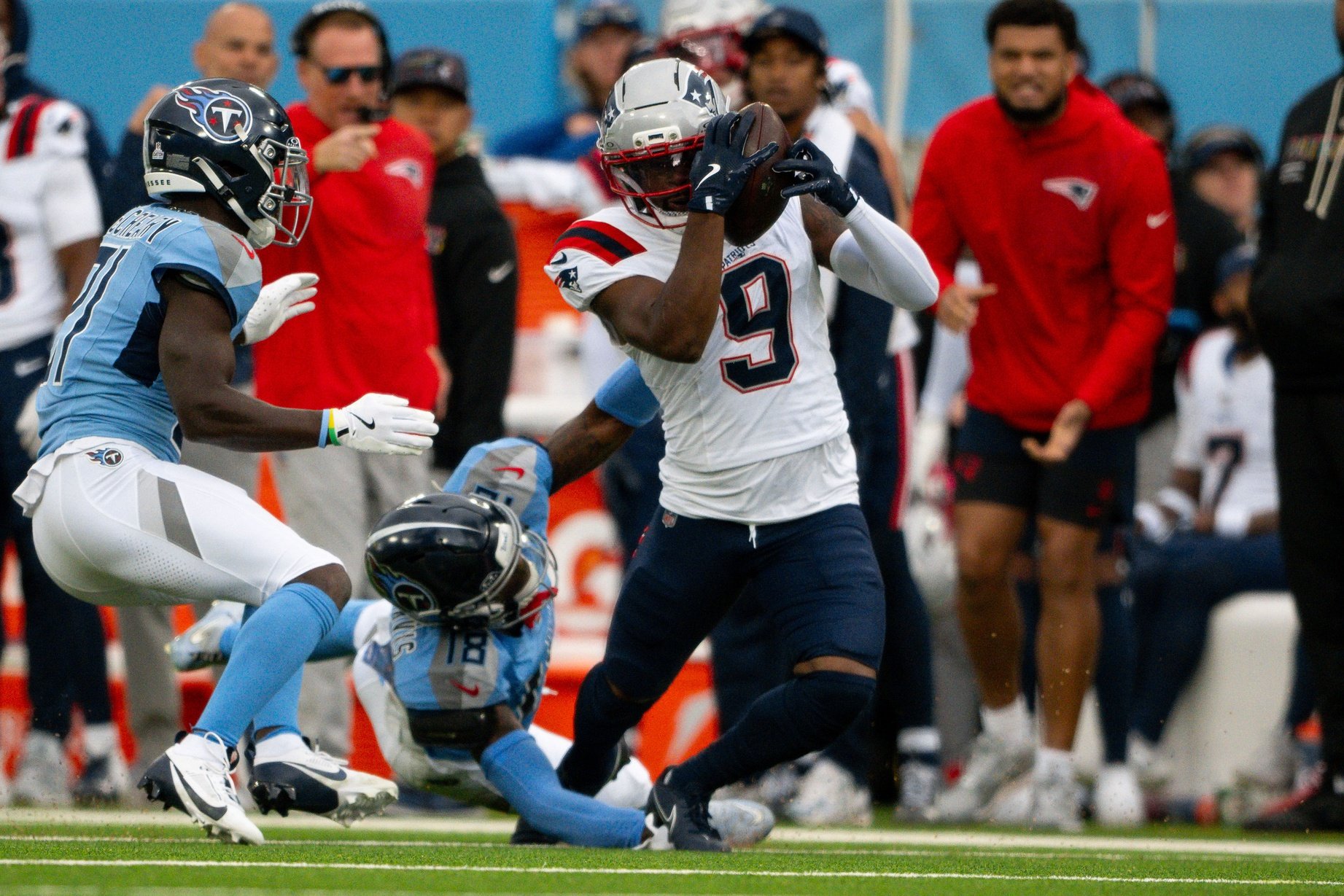 Oct 19, 2025; Nashville, Tennessee, USA;  New England Patriots wide receiver Kayshon Boutte (9) makes a catch in front of New England Patriots wide receiver Kyle Williams (18) during the first half at Nissan Stadium. Mandatory Credit: Steve Roberts-Imagn Images