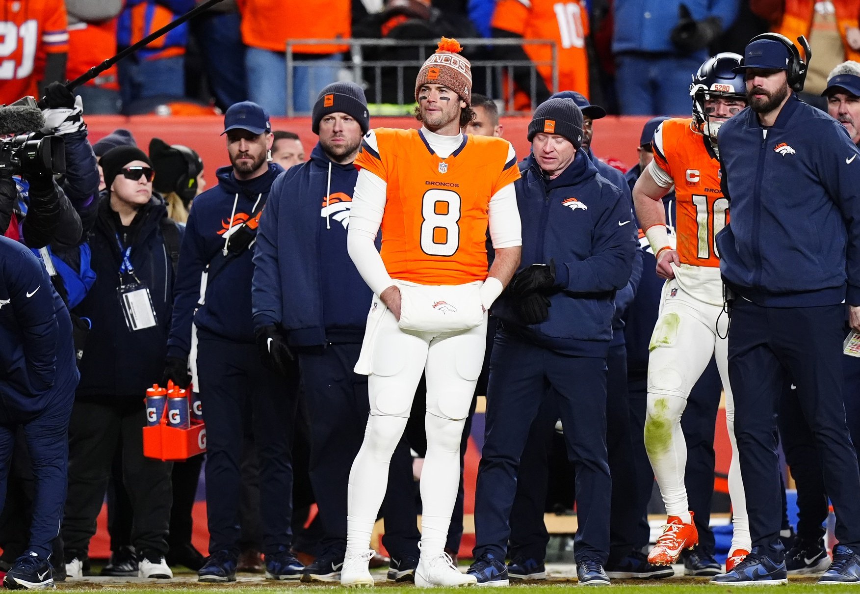 Jan 17, 2026; Denver, CO, USA; Denver Broncos quarterback Jarrett Stidham (8) stands next to quarterback Bo Nix (10)) during overtime of an AFC Divisional Round playoff game against the Buffalo Bills at Empower Field at Mile High. Mandatory Credit: Ron Chenoy-Imagn Images