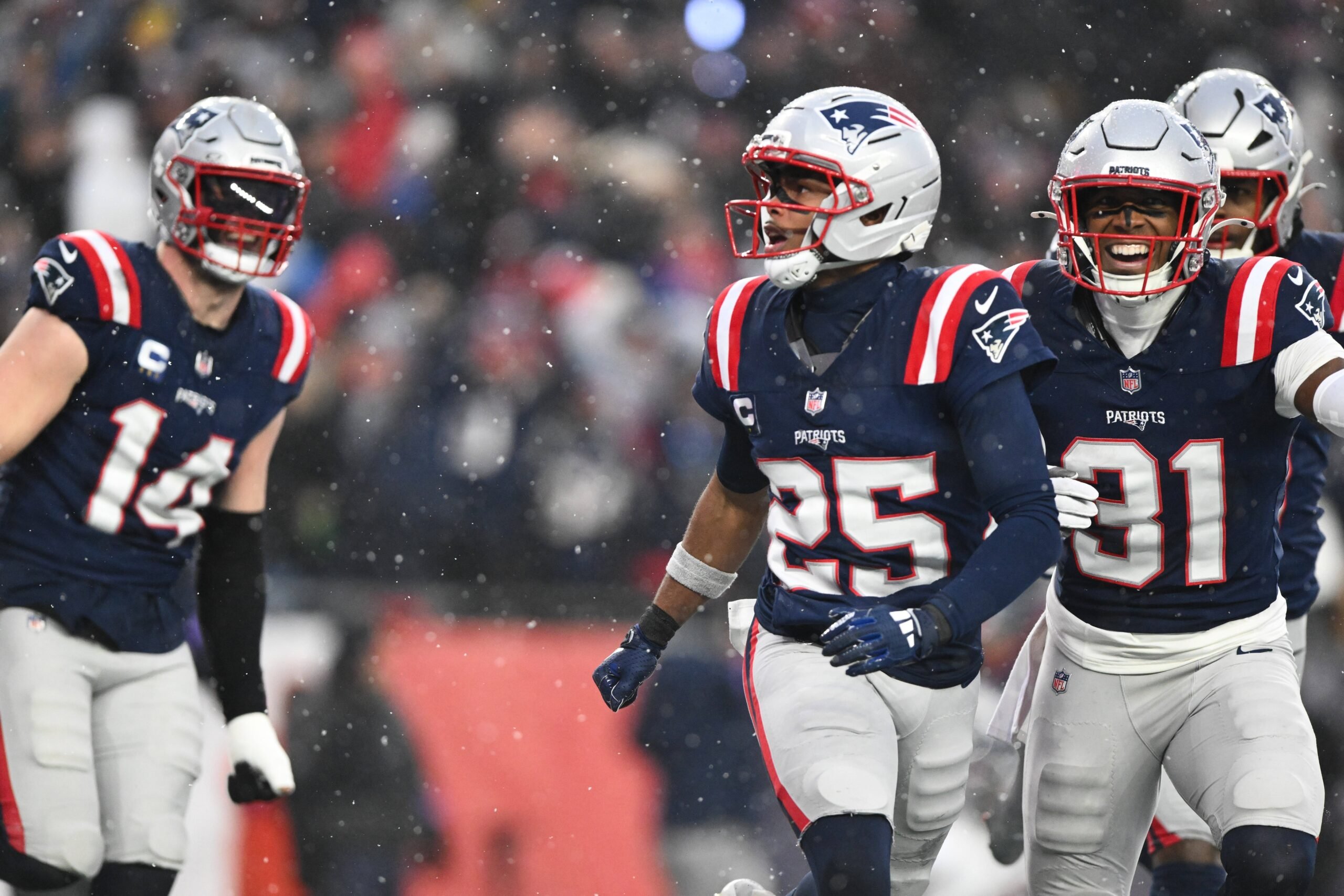 Jan 18, 2026; Foxborough, MA, USA; New England Patriots cornerback Marcus Jones (25) reacts after scoring a touchdown in the second quarter against the Houston Texans in an AFC Divisional Round game at Gillette Stadium. Mandatory Credit: Brian Fluharty-Imagn Images