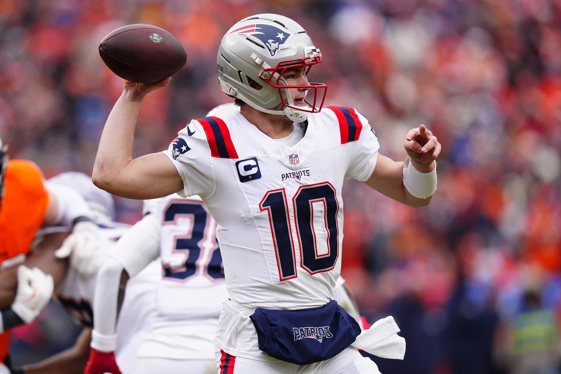 Jan 25, 2026; Denver, CO, USA; New England Patriots quarterback Drake Maye (10) drops back to pass against the Denver Broncos during the first half in the 2026 AFC Championship Game at Empower Field at Mile High. Mandatory Credit: Ron Chenoy-Imagn Images
