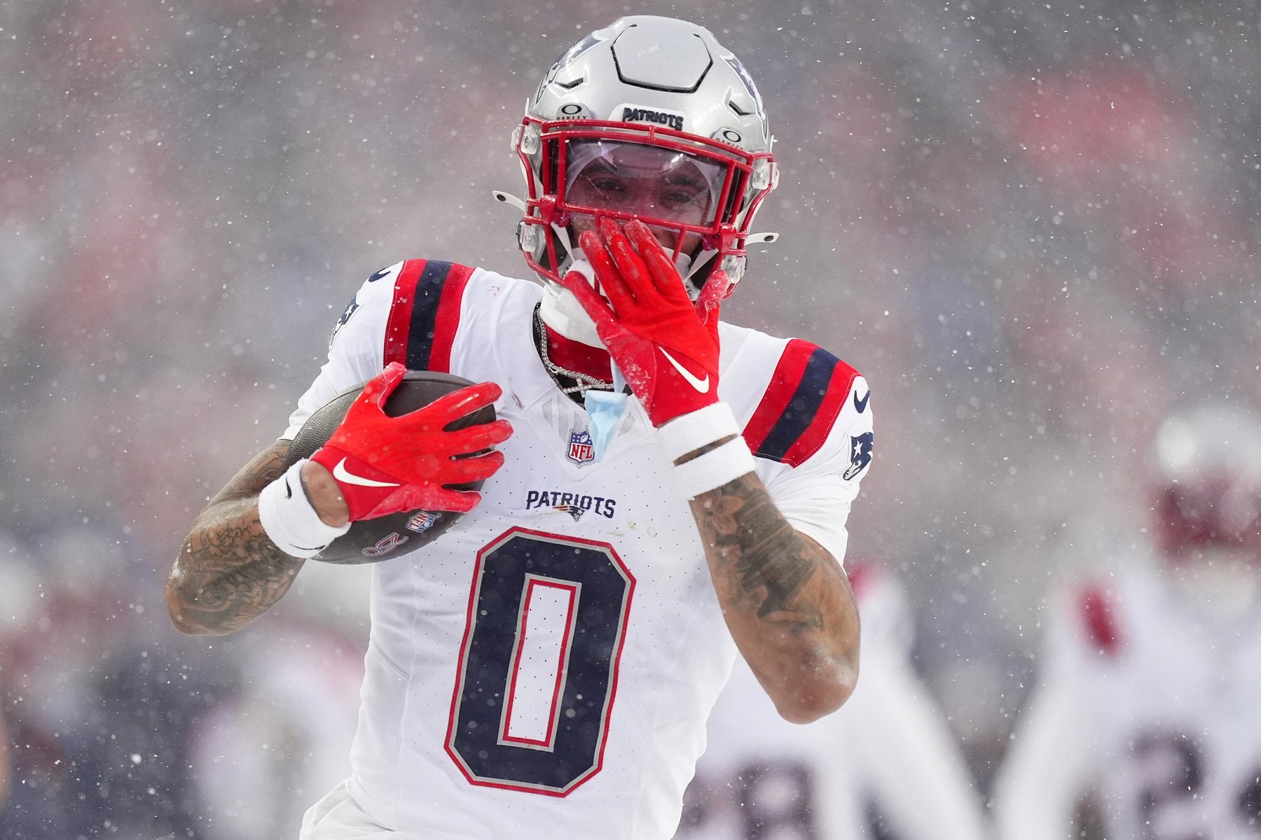 Jan 25, 2026; Denver, CO, USA; New England Patriots cornerback Christian Gonzalez (0) reacts after an interception against the Denver Broncos  during the second half in the 2026 AFC Championship Game at Empower Field at Mile High. Mandatory Credit: Ron Chenoy-Imagn Images