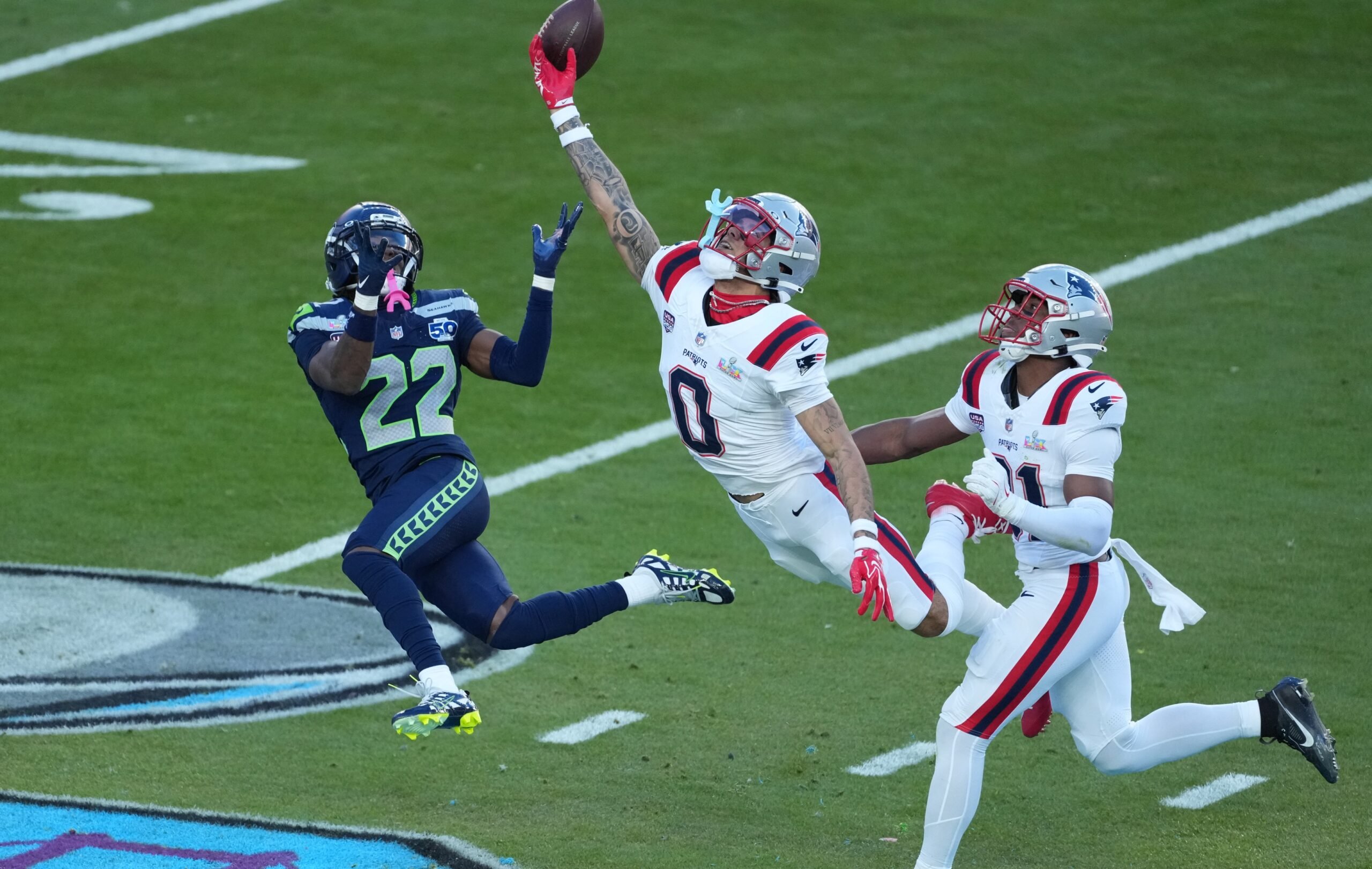 Feb 8, 2026; Santa Clara, CA, USA; New England Patriots cornerback Christian Gonzalez (0) breaks up a pass intended for Seattle Seahawks wide receiver Rashid Shaheed (22) in the first half in Super Bowl LX at Levi's Stadium. Mandatory Credit: Kirby Lee-Imagn Images