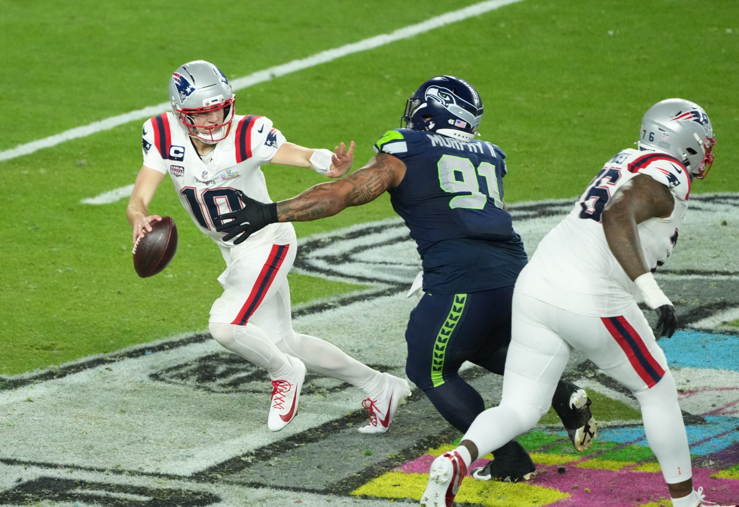 Feb 8, 2026; Santa Clara, CA, USA; New England Patriots quarterback Drake Maye (10) is pressured by Seattle Seahawks defensive tackle Byron Murphy II (91) in the second half in Super Bowl LX at Levi's Stadium. Mandatory Credit: Kirby Lee-Imagn Images