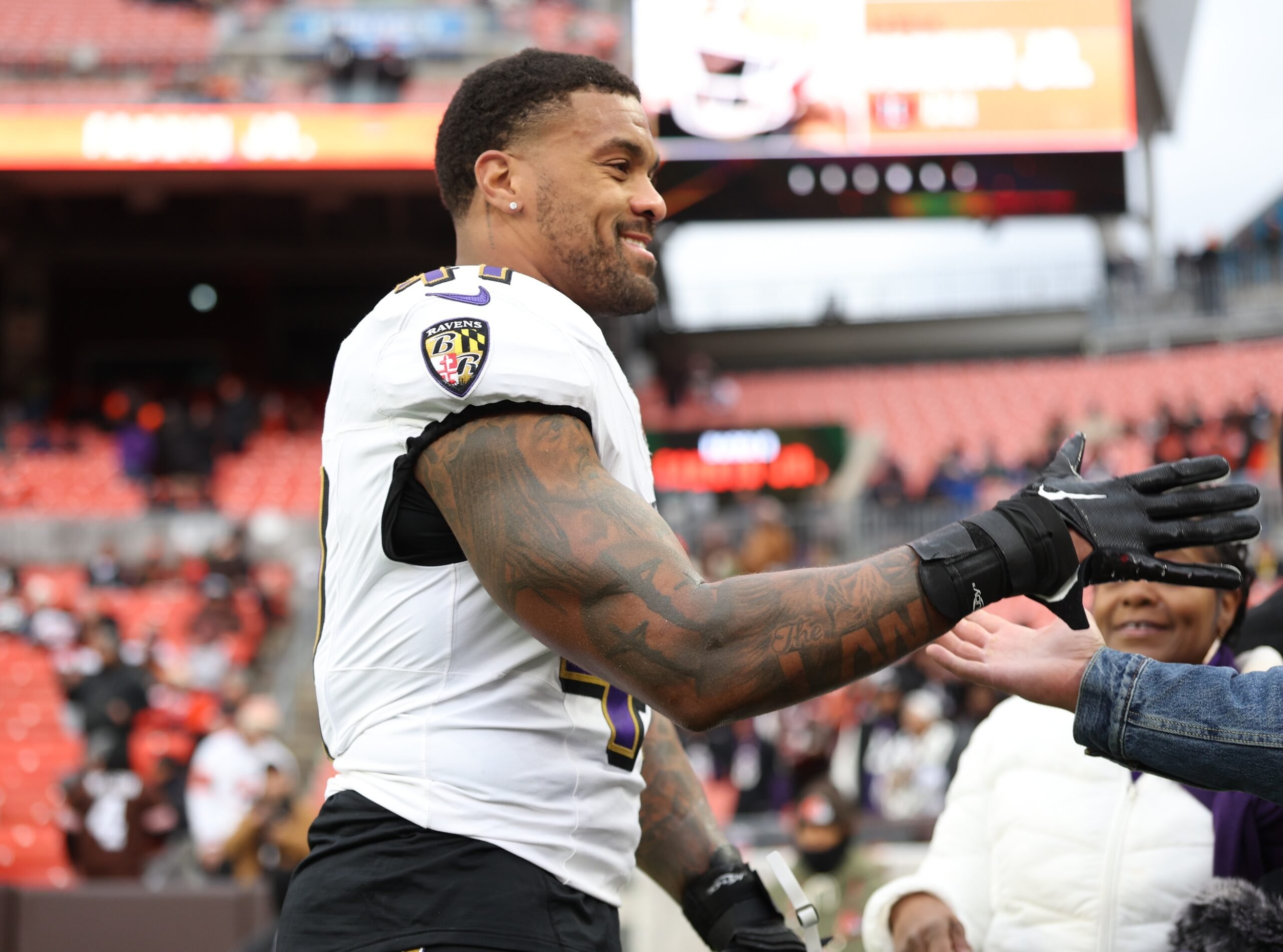Nov 16, 2025; Cleveland, Ohio, USA; Baltimore Ravens linebacker Dre'Mont Jones (41) greets fans prior to a game against the Cleveland Browns at Huntington Bank Field. Mandatory Credit: Scott Galvin-Imagn Images