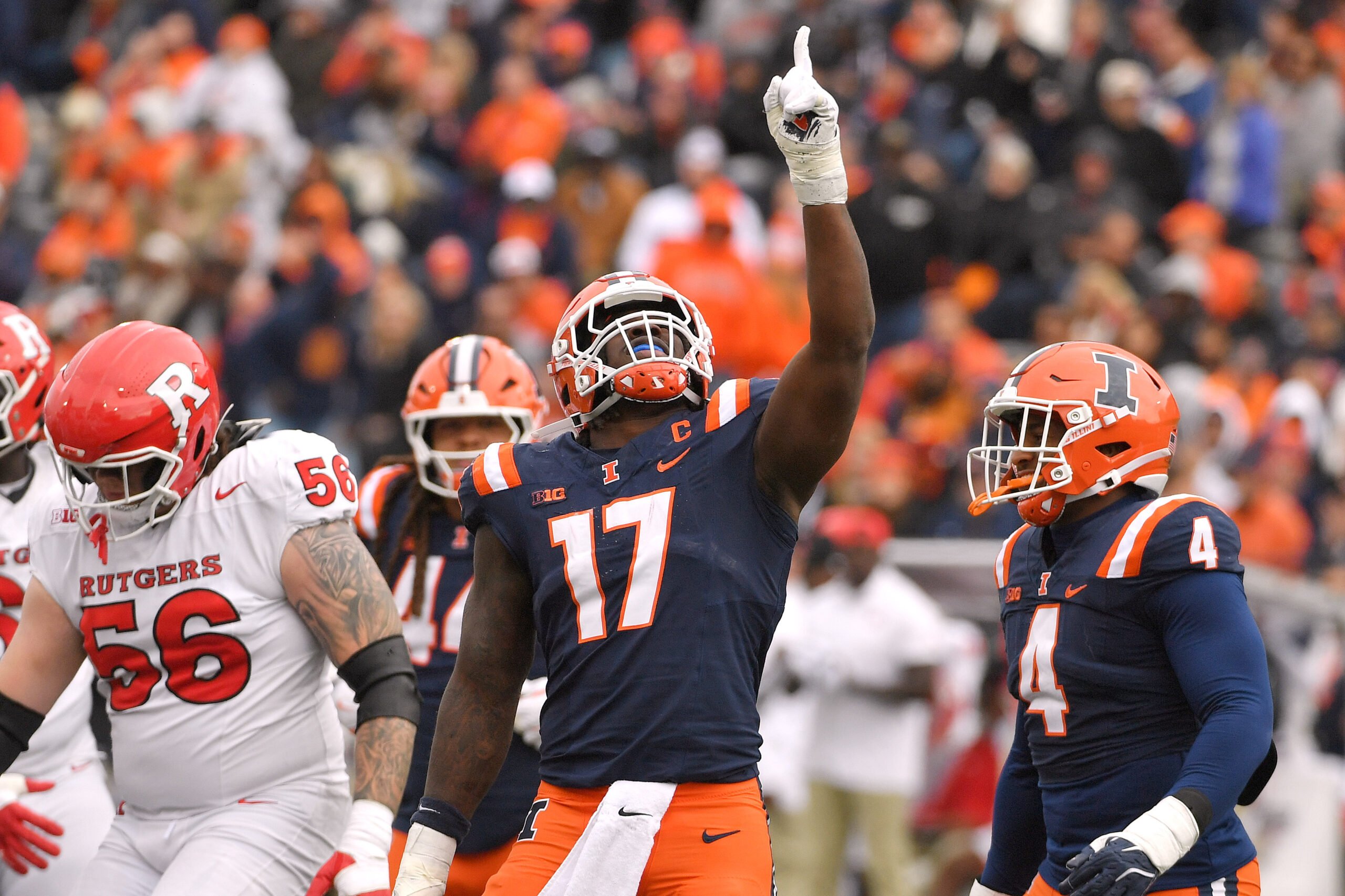 Nov 1, 2025; Champaign, Illinois, USA;  Illinois Fighting Illini linebacker Gabe Jacas (17) celebrates his sack on Rutgers Scarlet Knights quarterback Athan Kaliakmanis (16) during the first half at Memorial Stadium. Mandatory Credit: Ron Johnson-Imagn Images
