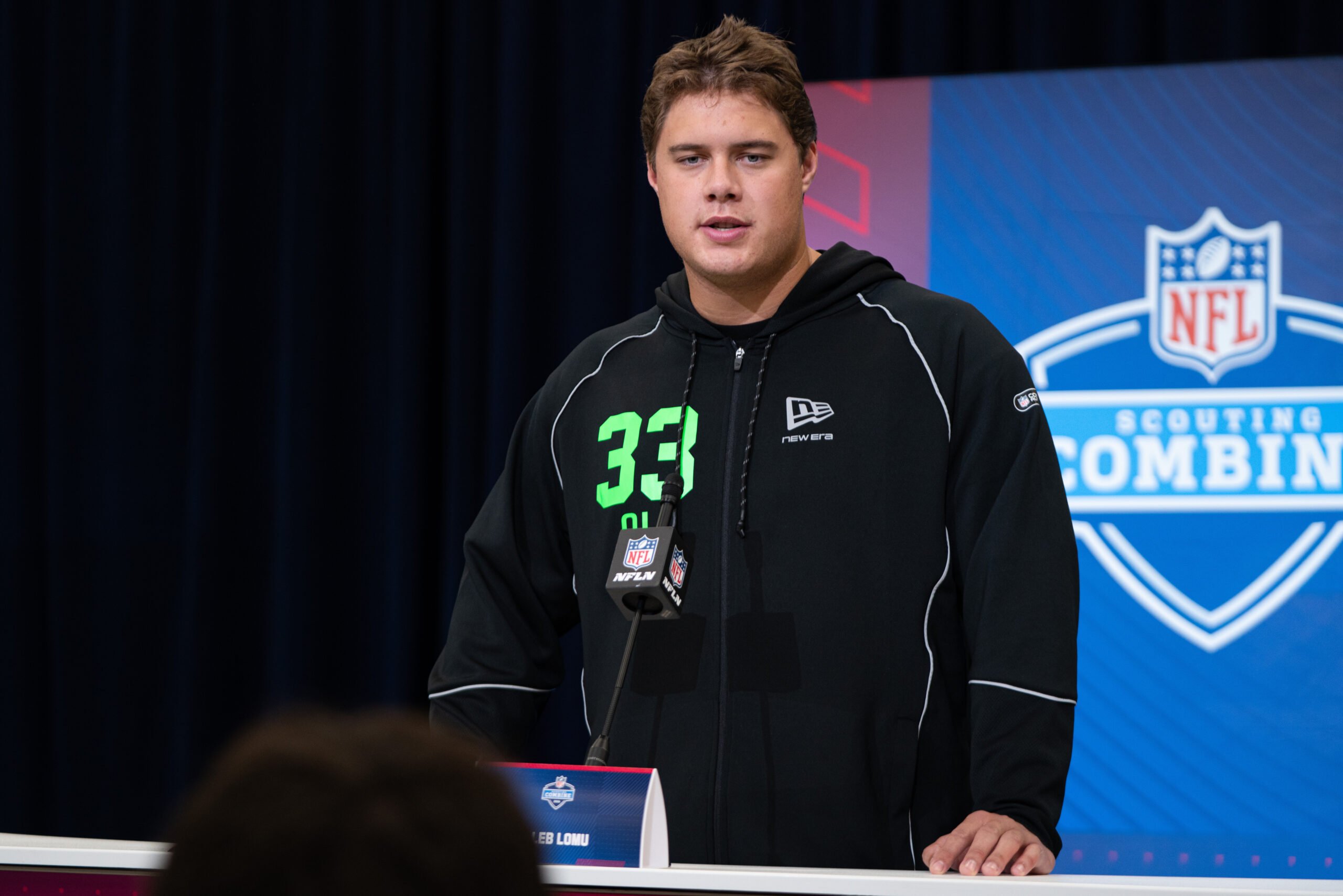 Feb 28, 2026; Indianapolis, IN, USA; Utah offensive lineman Caleb Lomu (OL33) speaks to members of the media during the NFL Combine at the Indiana Convention Center. Mandatory Credit: Jacob Musselman-Imagn Images