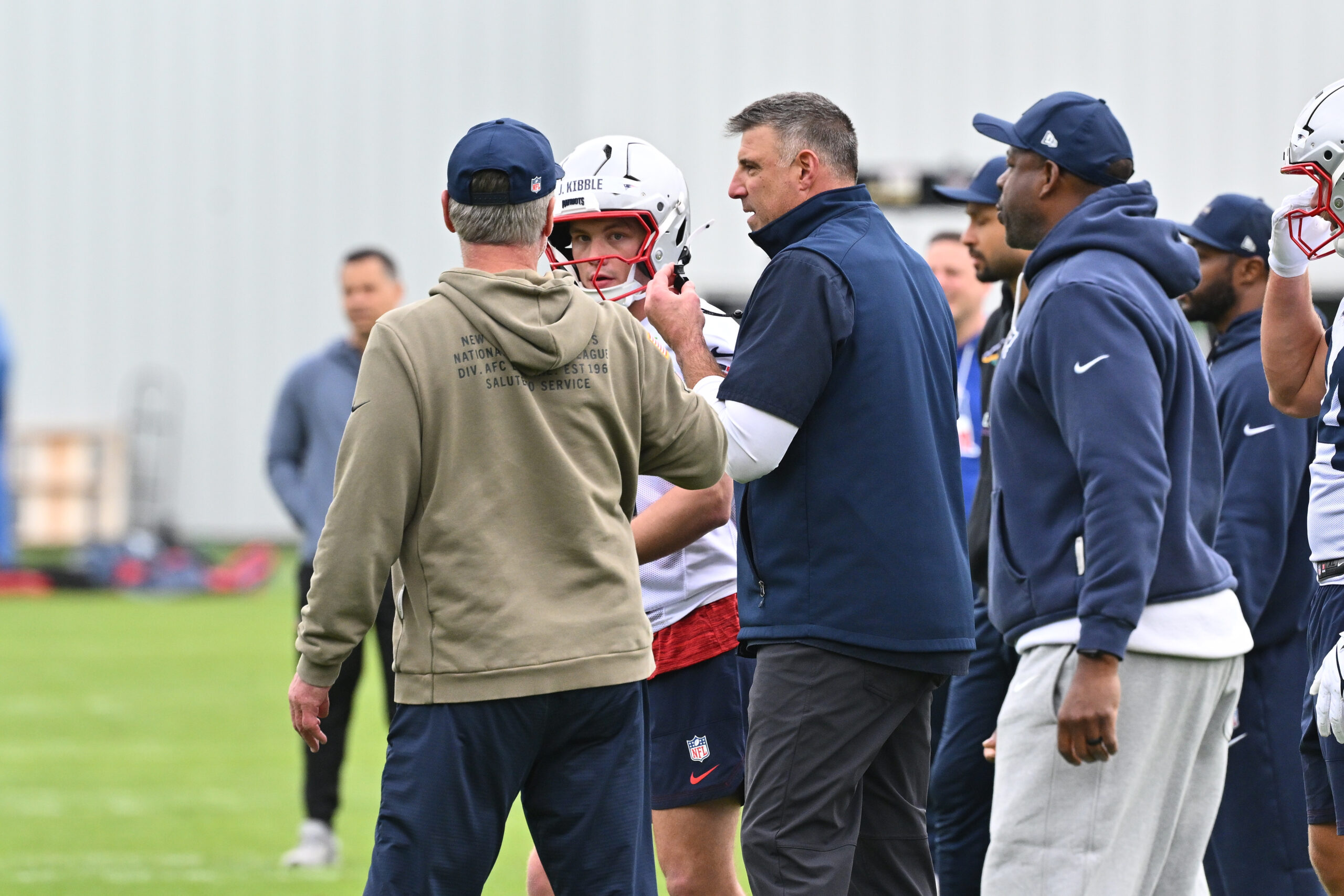 May 9, 2026; Foxborough, MA, USA; New England Patriots head coach Mike Vrabel (center) sets up a drill during the New England Patriots rookie camp at Gillette Stadium. Mandatory Credit: Eric Canha-Imagn Images