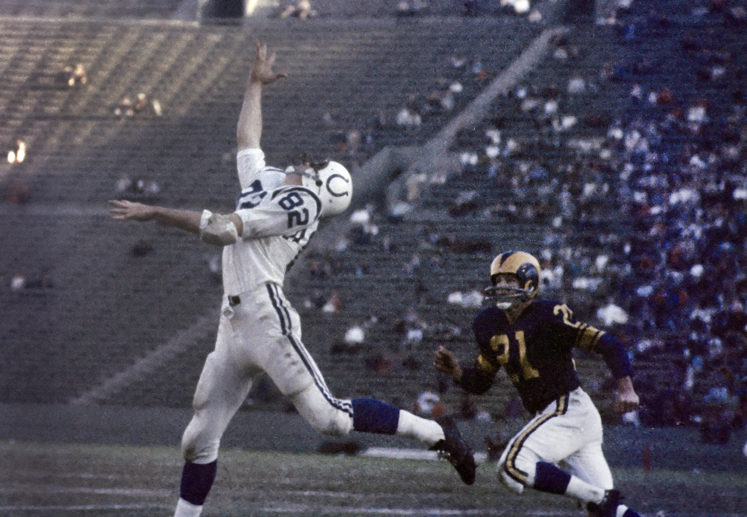 Dec 12, 1959; Los Angeles, CA, USA; FILE PHOTO; Los Angeles Rams defensive back Eddie Meador (21) defends Baltimore Colts receiver Raymond Berry (82) at the Los Angeles Memorial Coliseum. Mandatory Credit: David Boss-USA TODAY Sports