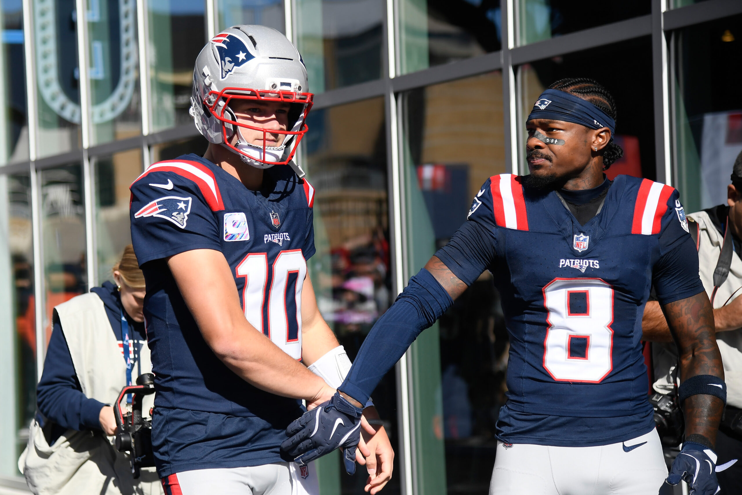 Oct 26, 2025; Foxborough, Massachusetts, USA; New England Patriots quarterback Drake Maye (10) and wide receiver Stefon Diggs (8) get ready to take the field prior to a game against the Cleveland Browns at Gillette Stadium. Mandatory Credit: Bob DeChiara-Imagn Images