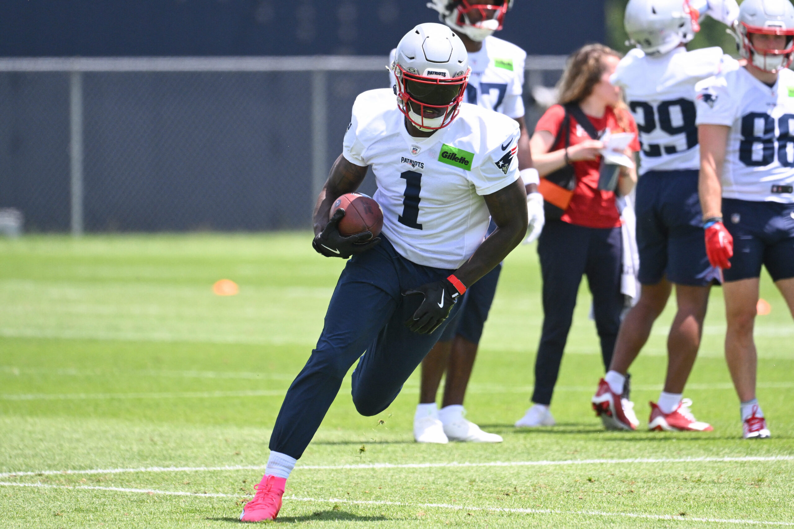 Jun 2, 2026; Foxborough, MA, USA; New England Patriots wide receiver A.J. Brown (1) runs after making a catch during the team's OTA at Gillette Stadium. Mandatory Credit: Eric Canha-Imagn Images