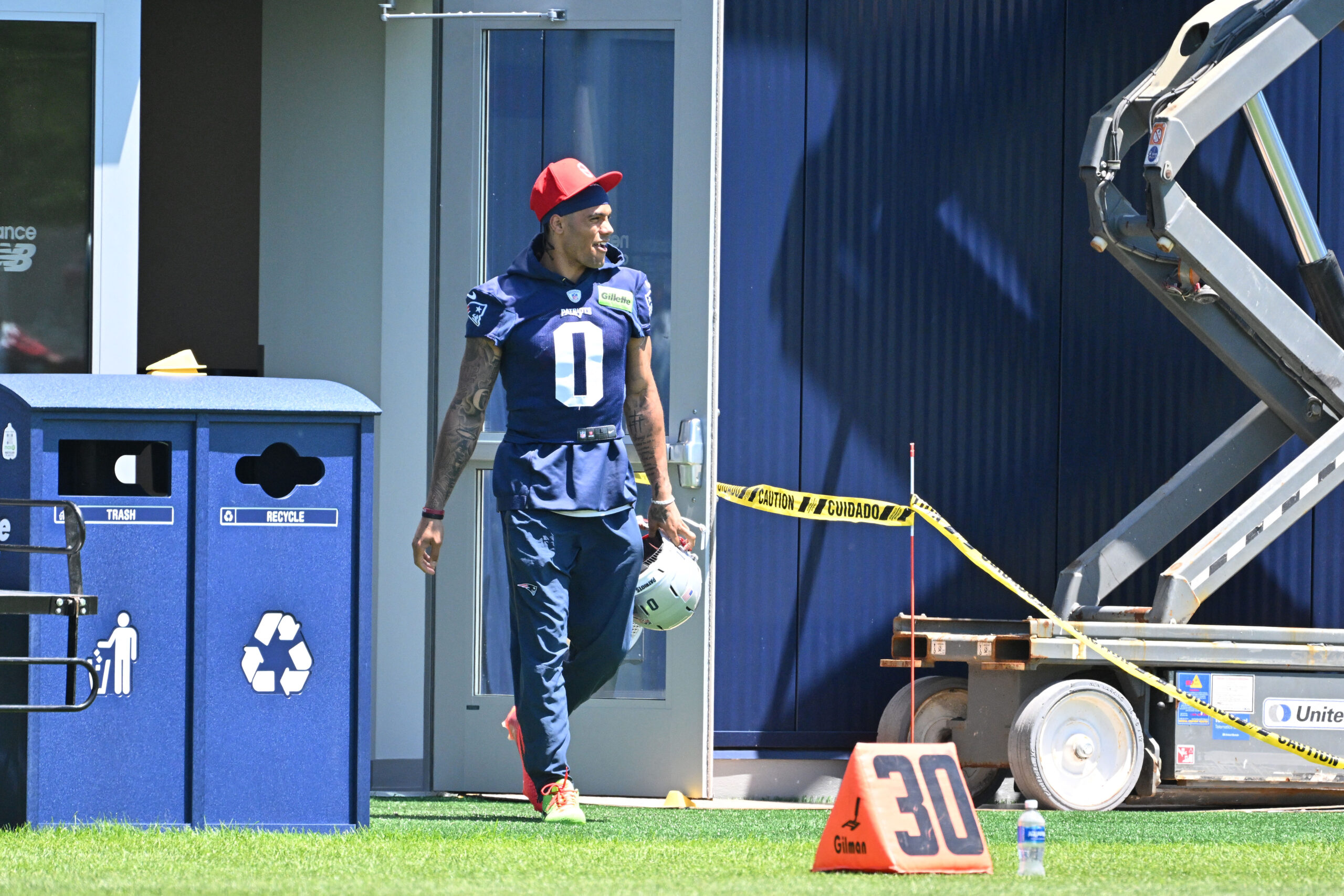Jun 9, 2026; Foxborough, MA, USA; New England Patriots cornerback Christian Gonzalez (0) arrives to the practice field for minicamp at Gillette Stadium. Mandatory Credit: Eric Canha-Imagn Images