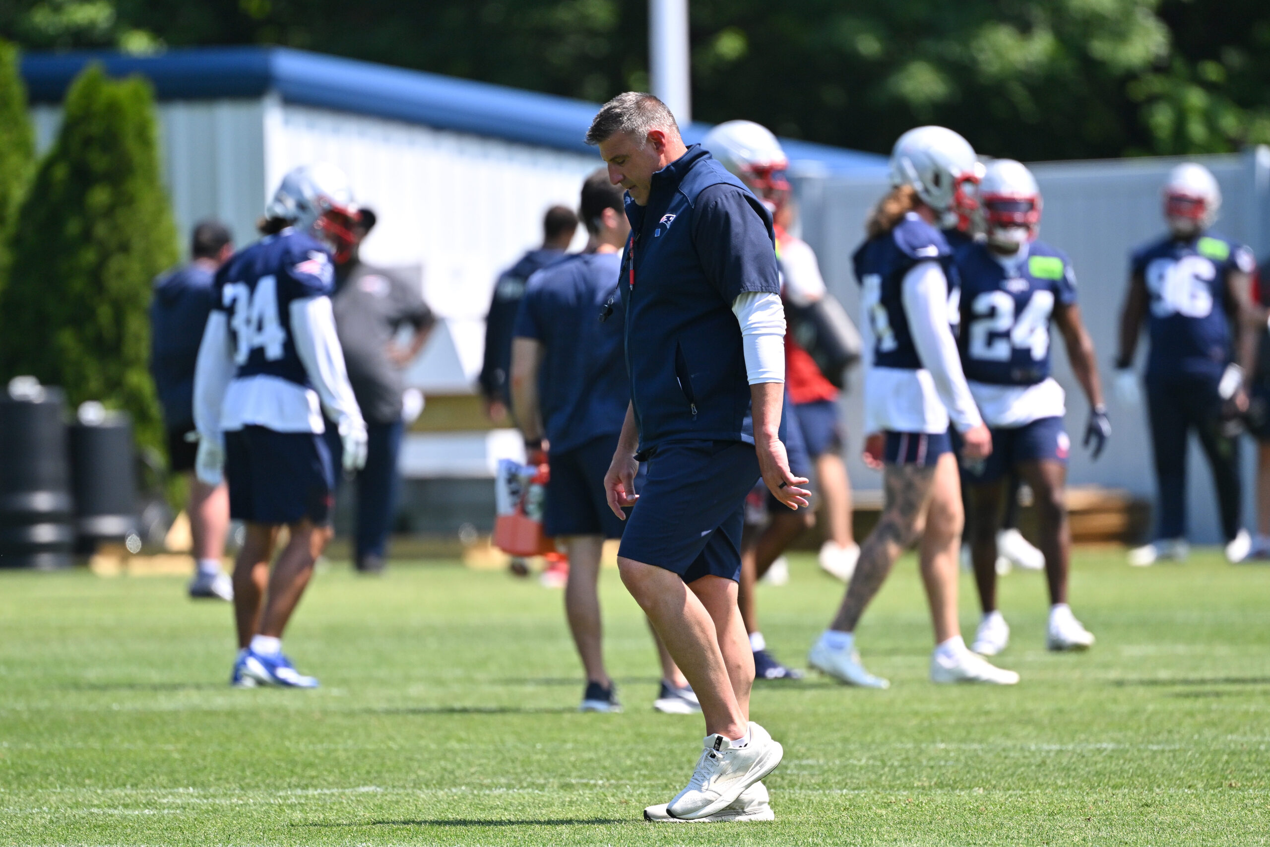 Jun 10, 2026; Foxborough, MA, USA; New England Patriots head coach Mike Vrabel walks between offensive and defensive units during minicamp at Gillette Stadium. Mandatory Credit: Eric Canha-Imagn Images