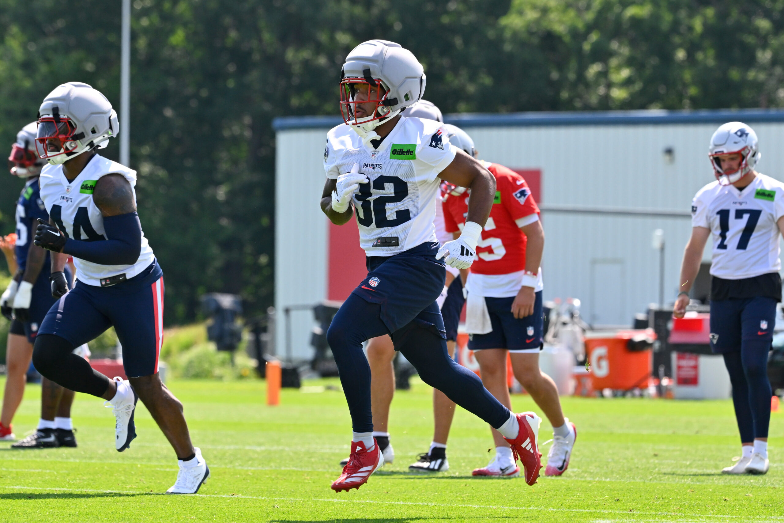 Jul 25, 2026; Foxborough, MA, USA; New England Patriots running back Treveyon Henderson (32) warms up at training camp at Gillette Stadium. Mandatory Credit: Eric Canha-Imagn Images