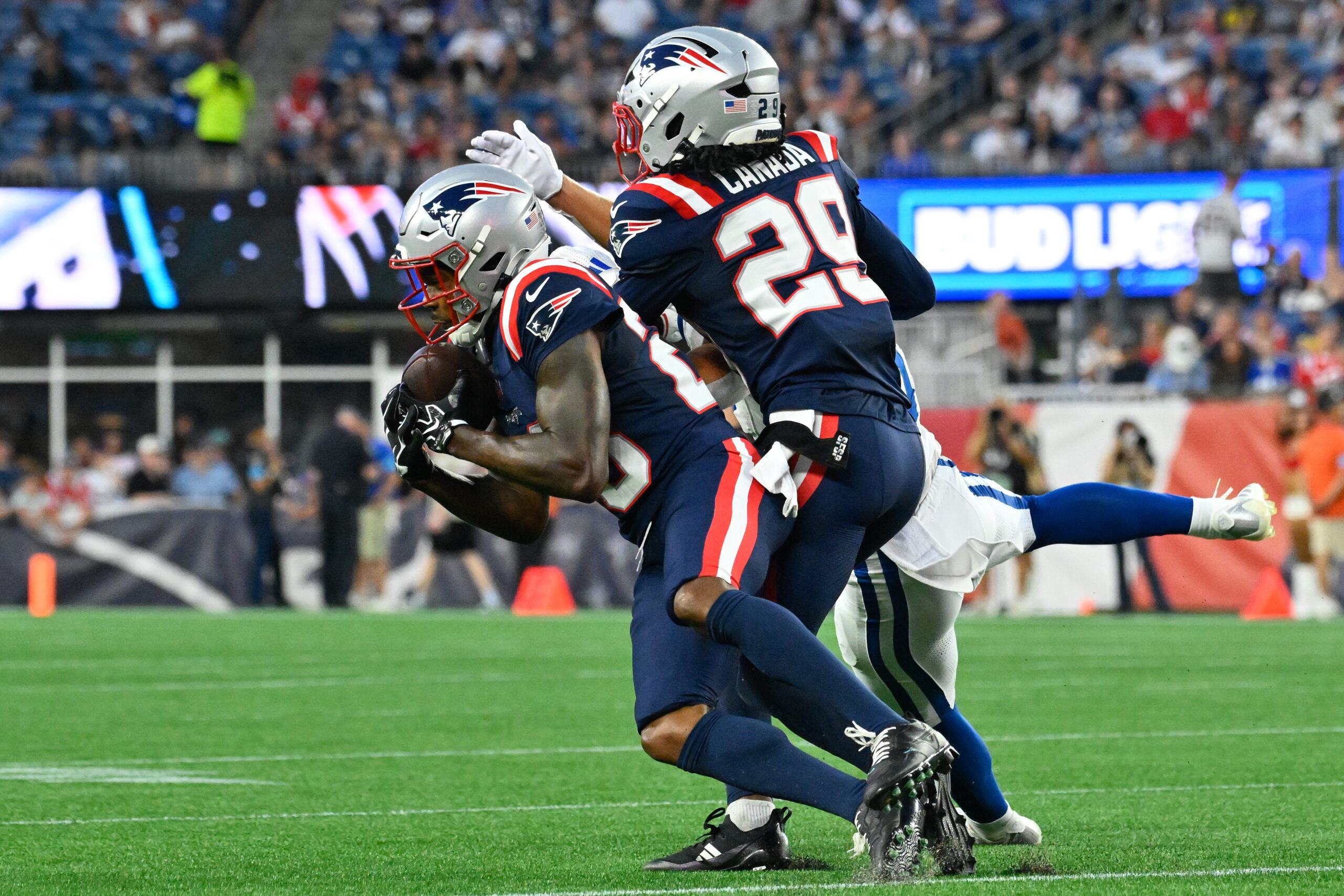 Aug 13, 2026; Foxborough, Massachusetts, USA; New England Patriots cornerback Kindle Vildor (28) intercepts a pass to Indianapolis Colts wide receiver Coleman Owen (9) during the first half at Gillette Stadium. Mandatory Credit: Eric Canha-Imagn Images