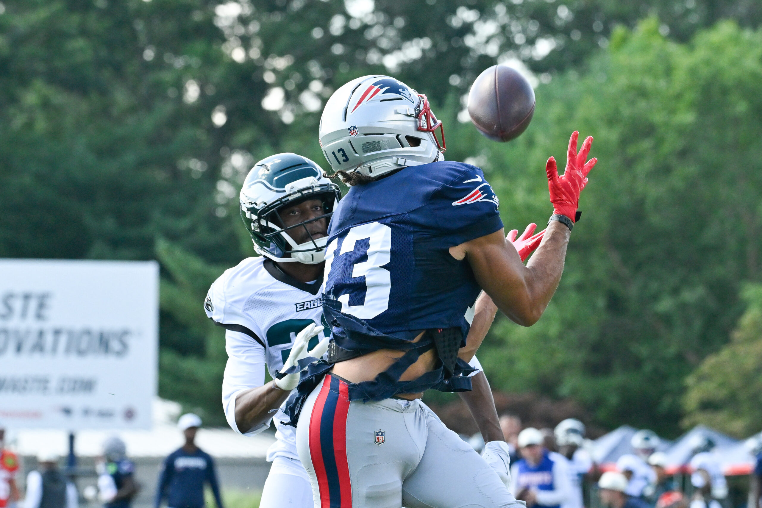Aug 19, 2026; Foxborough, Massachusetts, USA; New England Patriots wide receiver Mack Hollins (13) makes a catch against Philadelphia Eagles cornerback Ambry Thomas (38) during training camp at Gillette Stadium. Mandatory Credit: Eric Canha-Imagn Images