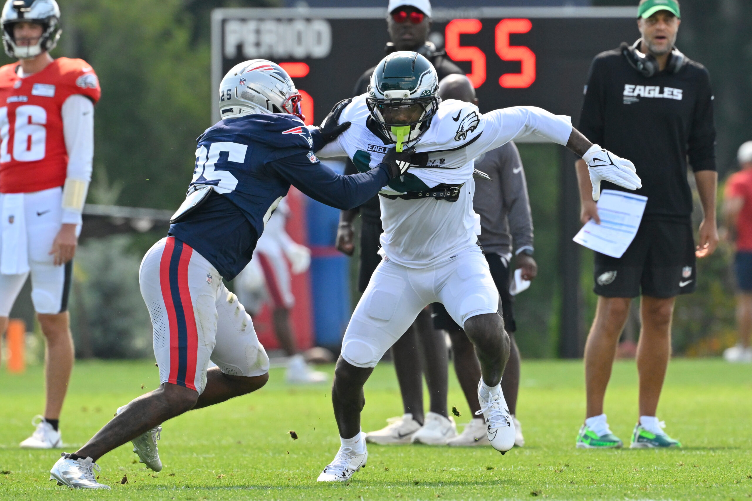 Aug 19, 2026; Foxborough, Massachusetts, USA; New England Patriots cornerback Marcus Jones (25) covers Philadelphia Eagles wide receiver Elijah Moore (19) during training camp at Gillette Stadium. Mandatory Credit: Eric Canha-Imagn Images