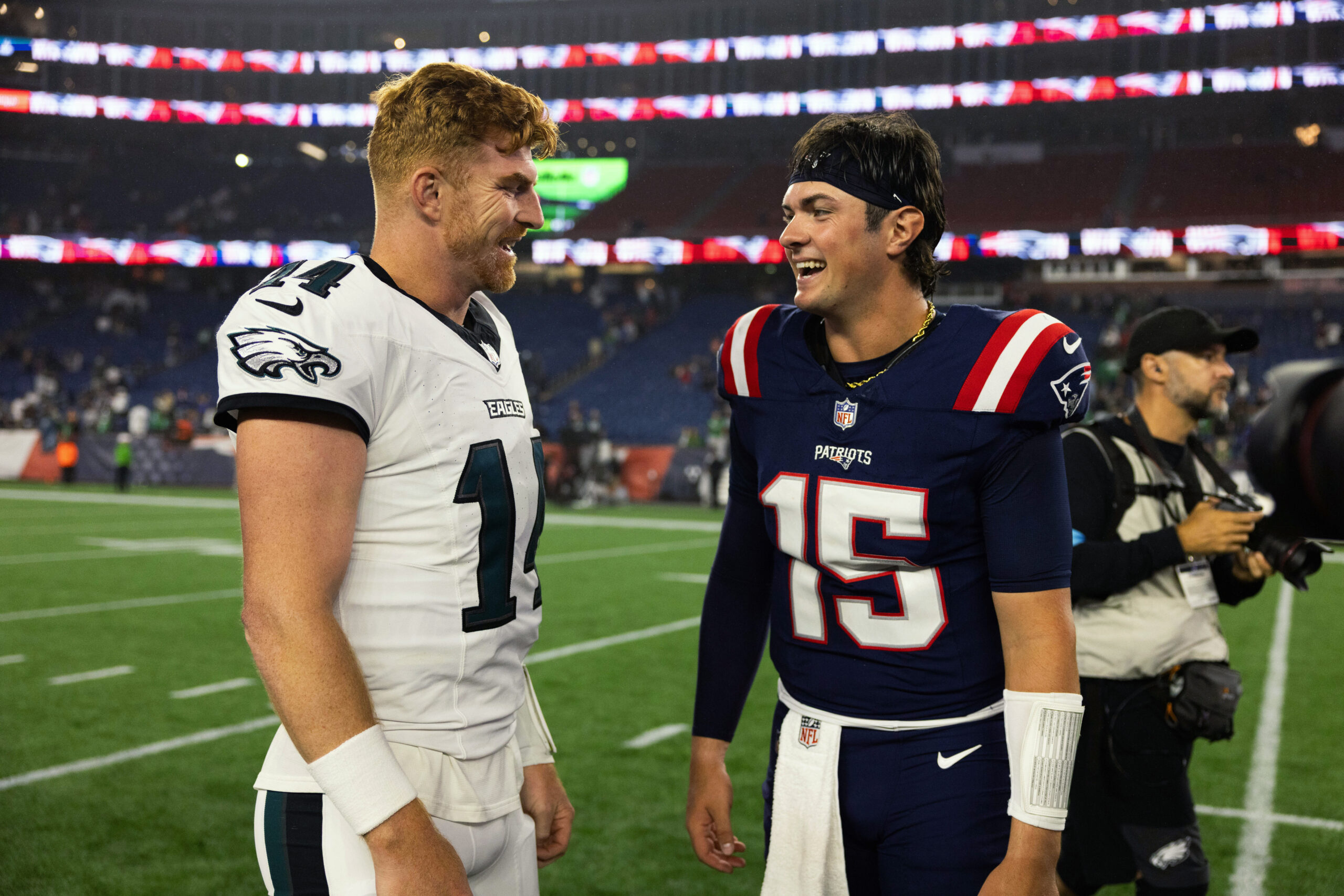 Aug 22, 2026; Foxborough, Massachusetts, USA; Philadelphia Eagles quarterback Andy Dalton (14) chats with New England Patriots quarterback Behren Morton (15) after the game at Gillette Stadium. Mandatory Credit: Edward Finan-Imagn Images