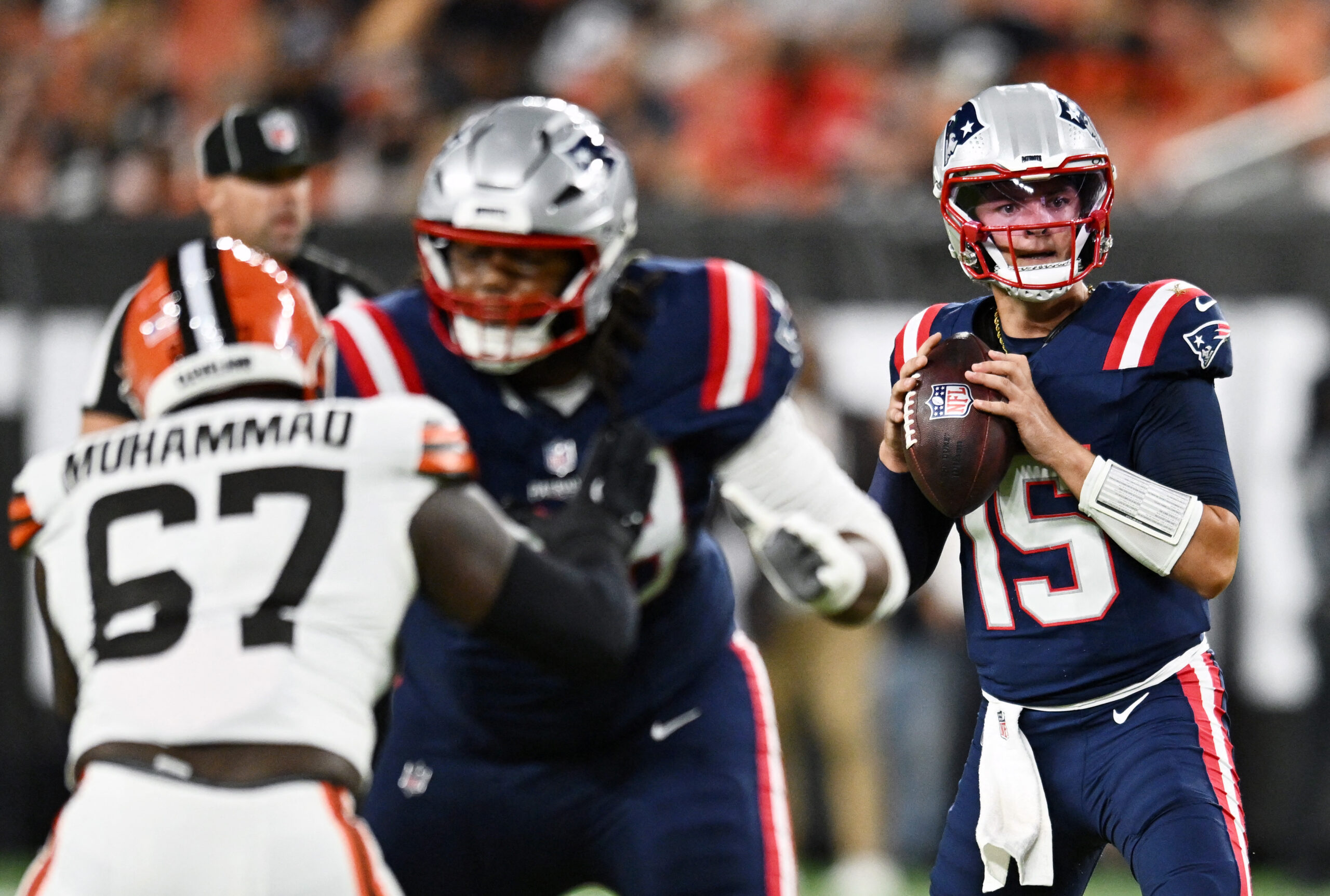Aug 27, 2026; Cleveland, Ohio, USA; New England Patriots quarterback Behren Morton (15) surveys the field against the Cleveland Browns during the first half at Huntington Bank Field. Mandatory Credit: Ken Blaze-Imagn Images